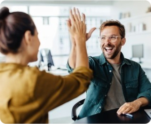 Two people high-fiving for streamlined decision-making and collaboration. Two people high-fiving for streamlined decision-making and collaboration.